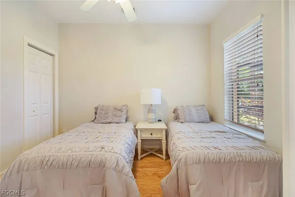 a bedroom with a bed and a night stand