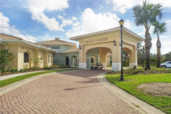 a view of a lake with a table and chairs
