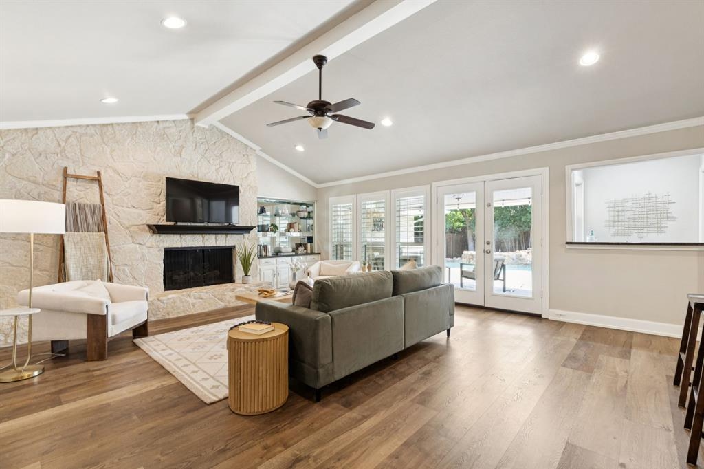 14420 Overview Drive Dallas, TX 75254 - Photo 15 of 35 a living room with furniture a fireplace and a flat screen tv