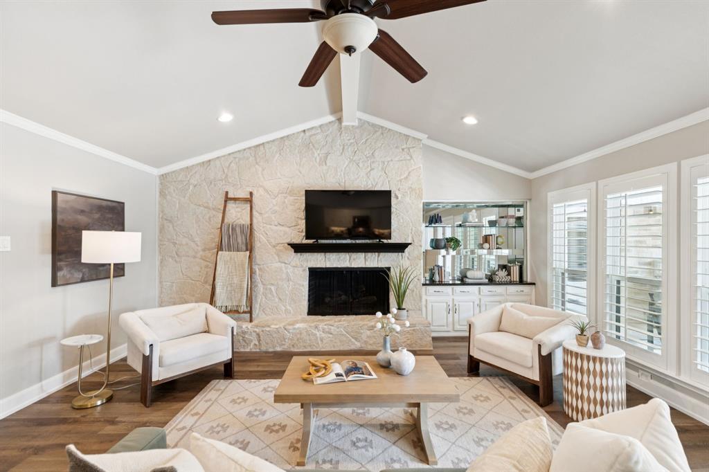 14420 Overview Drive Dallas, TX 75254 - Photo 16 of 35 a living room with furniture a flat screen tv and a fireplace