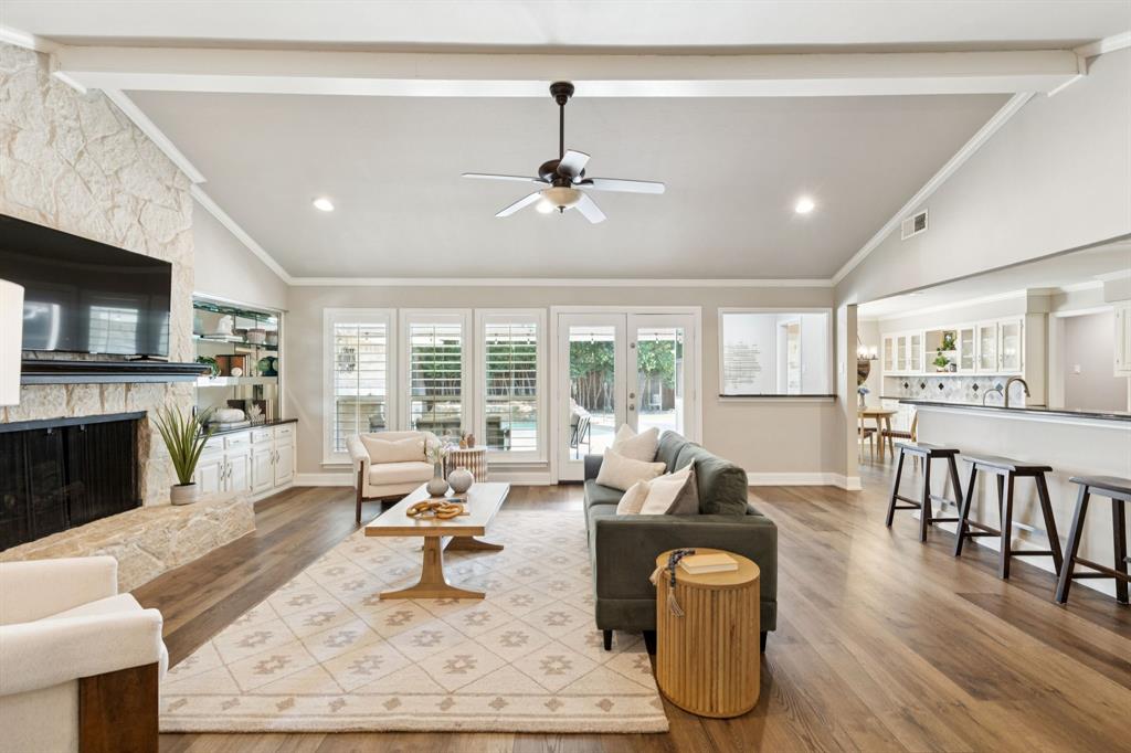 14420 Overview Drive Dallas, TX 75254 - Photo 17 of 35 a living room with fireplace furniture and a wooden floor