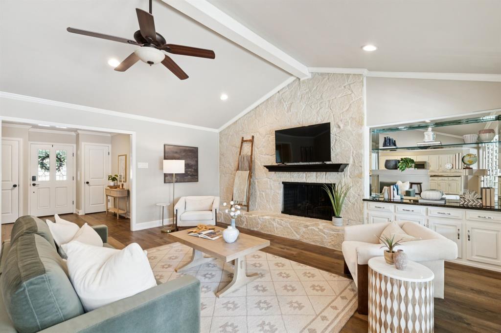 14420 Overview Drive Dallas, TX 75254 - Photo 18 of 35 a living room with furniture a fireplace and a flat screen tv