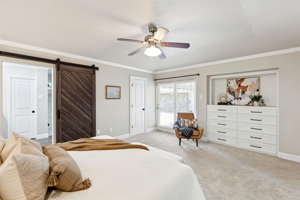 14420 Overview Drive Dallas, TX 75254 - Photo 24 of 35 a bedroom with a bed and wooden floor