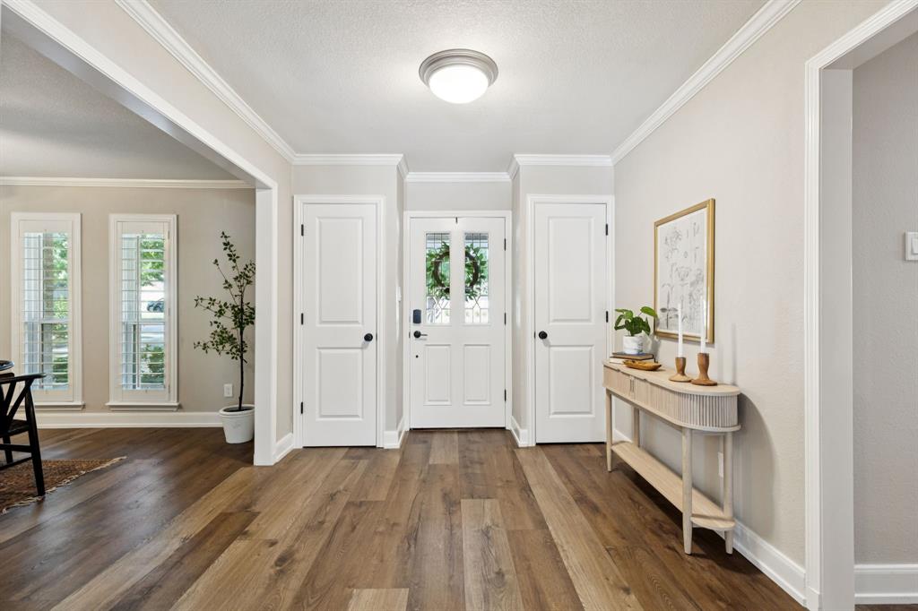 14420 Overview Drive Dallas, TX 75254 - Photo 4 of 35 a view of a hallway view with wooden floor and staircase