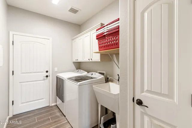 a utility room with dryer and washer
