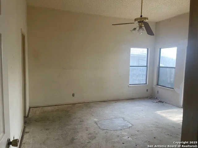 a white bath tub sitting next to a shower
