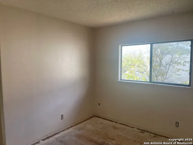 a view of a room that has a window