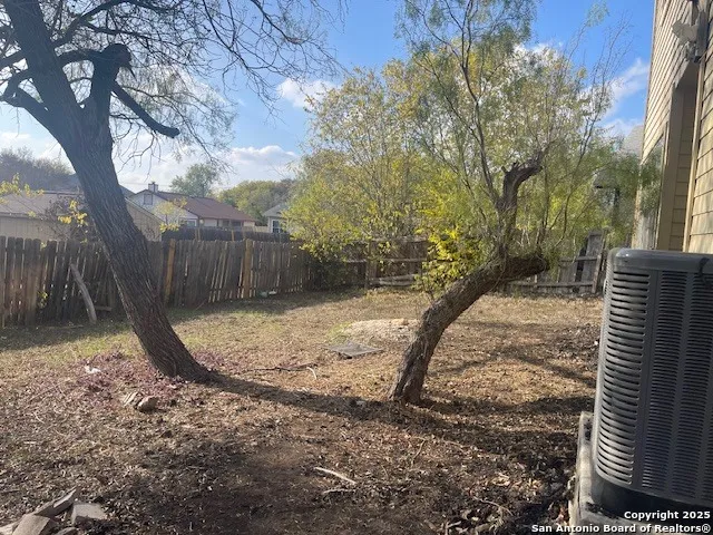 a view of a house with a yard and garage