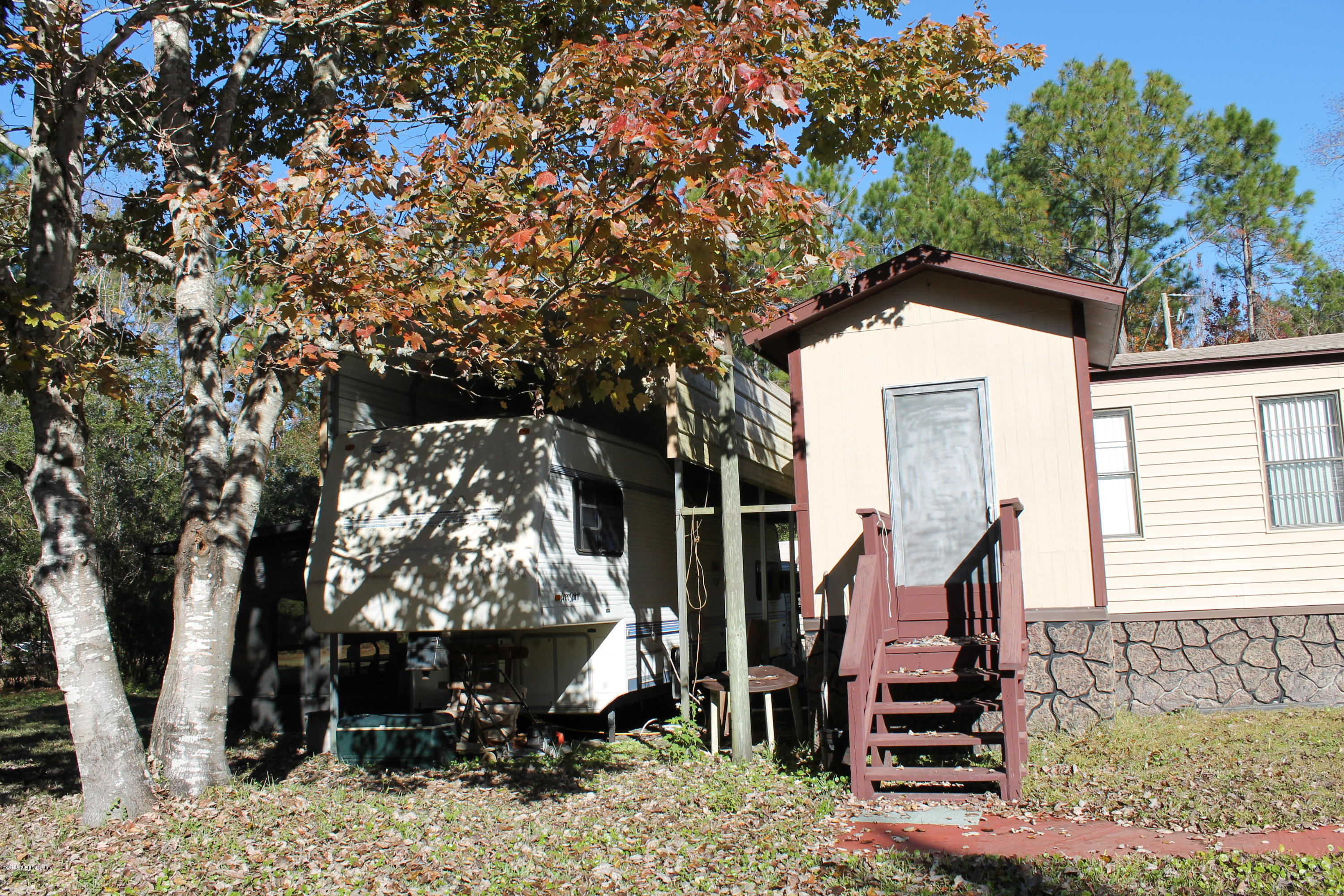 5697 Datil Pepper Road St. Augustine, FL 32086 - Photo 11 of 16 a front view of a house with a yard