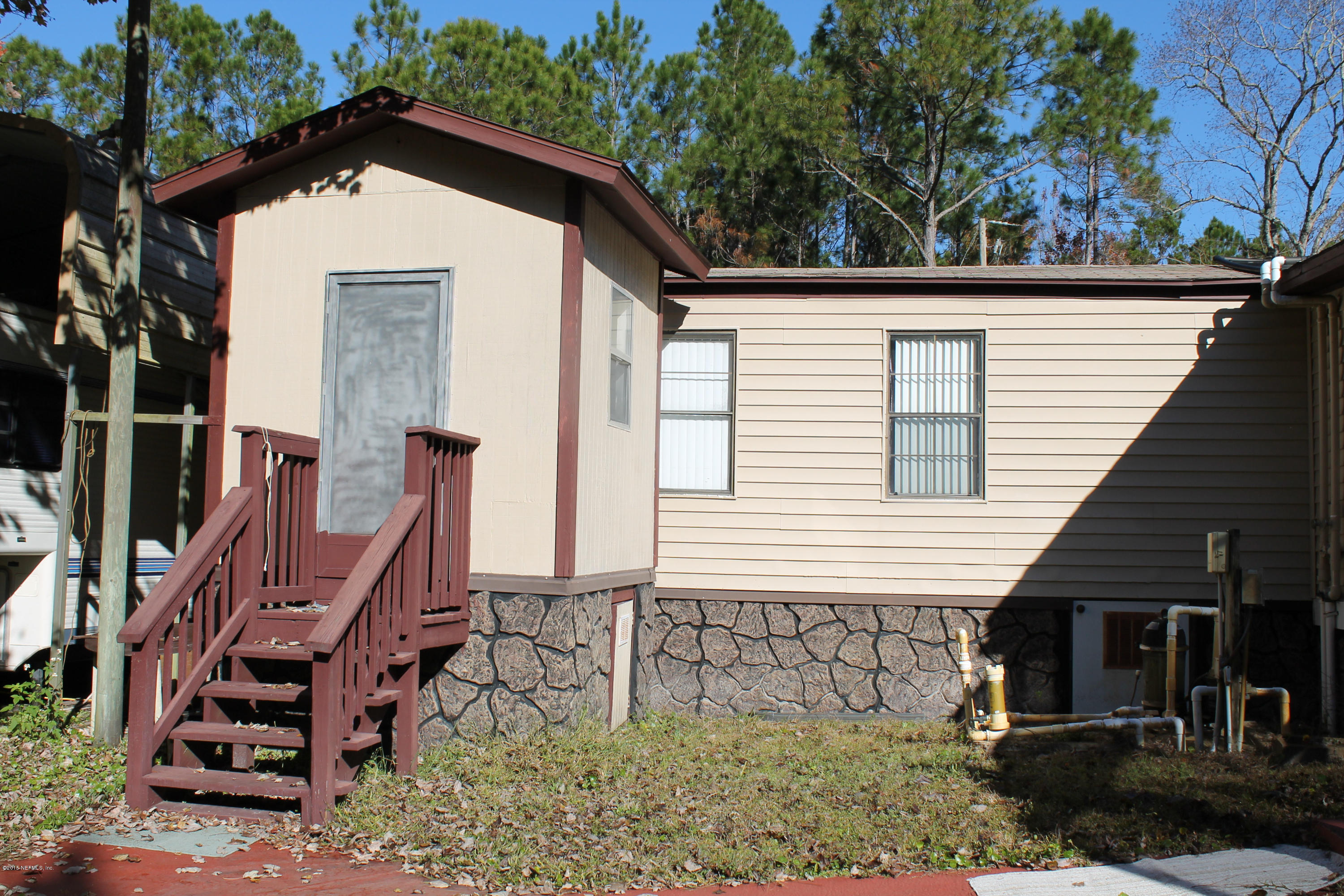 5697 Datil Pepper Road St. Augustine, FL 32086 - Photo 12 of 16 a view of a house with a yard
