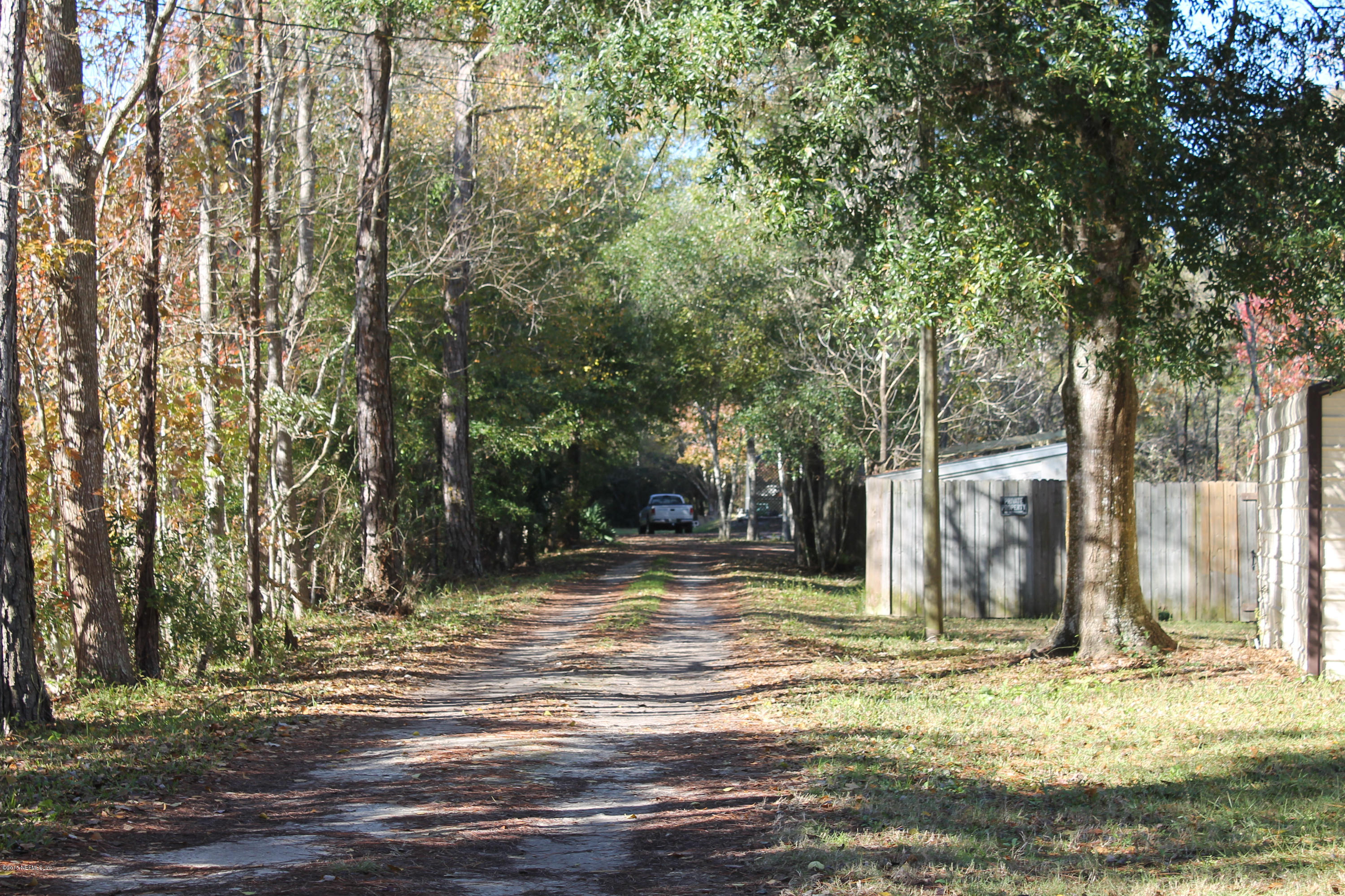 5697 Datil Pepper Road St. Augustine, FL 32086 - Photo 2 of 16 a view of a house with a yard