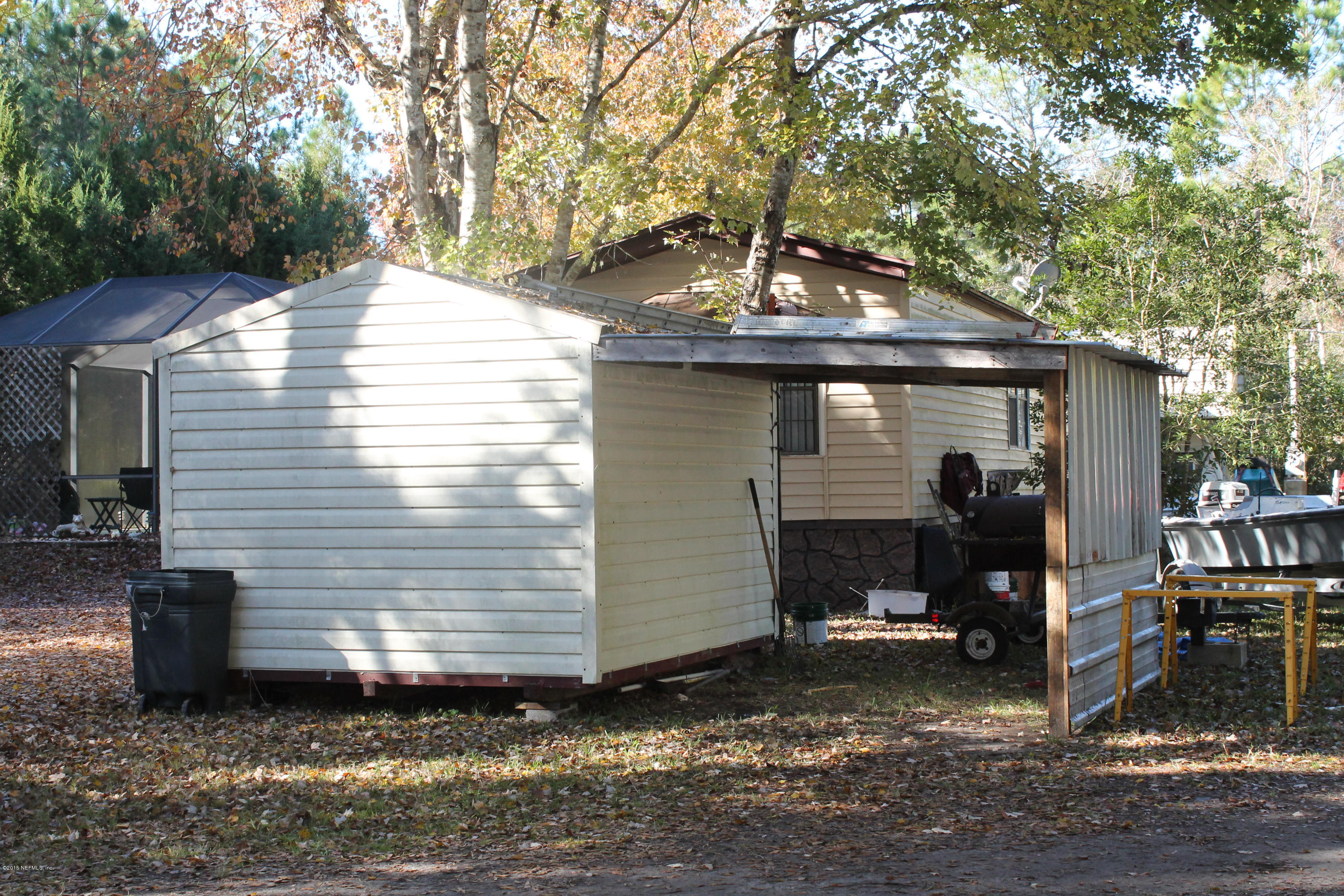 5697 Datil Pepper Road St. Augustine, FL 32086 - Photo 3 of 16 a view of a house with a yard