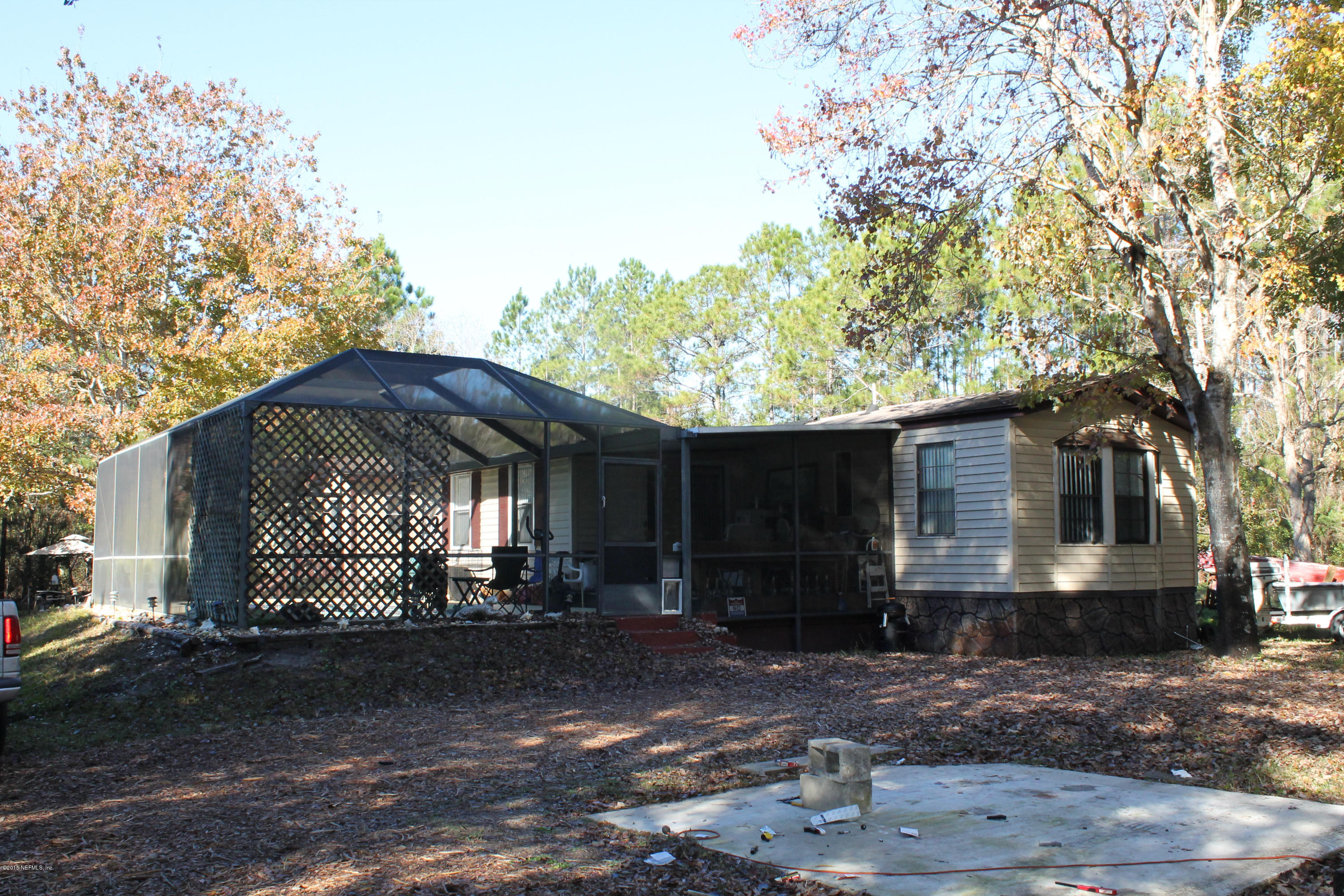 5697 Datil Pepper Road St. Augustine, FL 32086 - Photo 5 of 16 a front view of a house with a yard