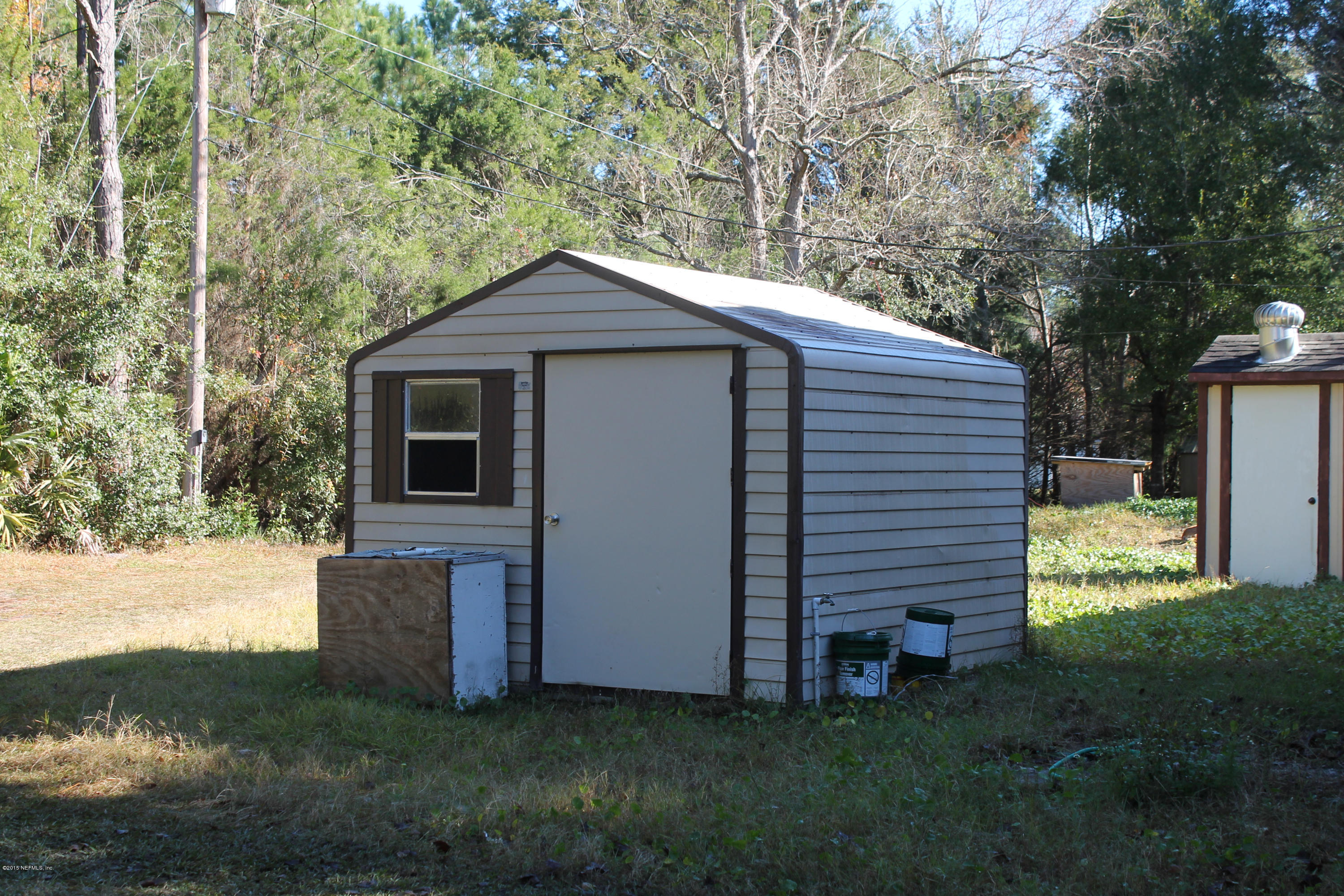 5697 Datil Pepper Road St. Augustine, FL 32086 - Photo 7 of 16 a front view of a house with garden