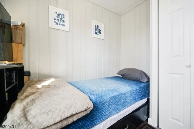 a bedroom with a bed and a table in it