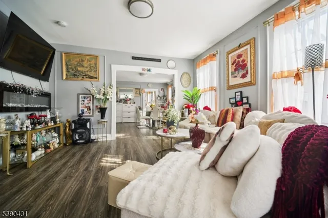 a bedroom with furniture and a flat screen tv