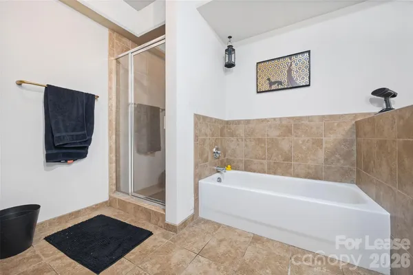 a bathroom with a bathtub and a shower