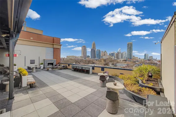 a very nice looking room with many windows and tables