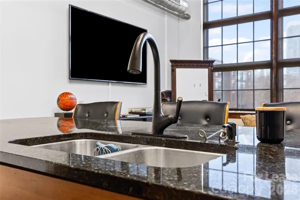 a kitchen with a sink and a microwave