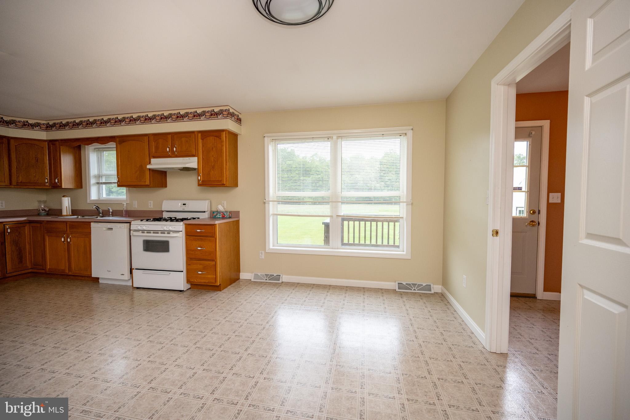 386 Marlin Savage Road Accident, MD 21520 - Photo 27 of 63 a view of a kitchen with a sink cabinets and a window