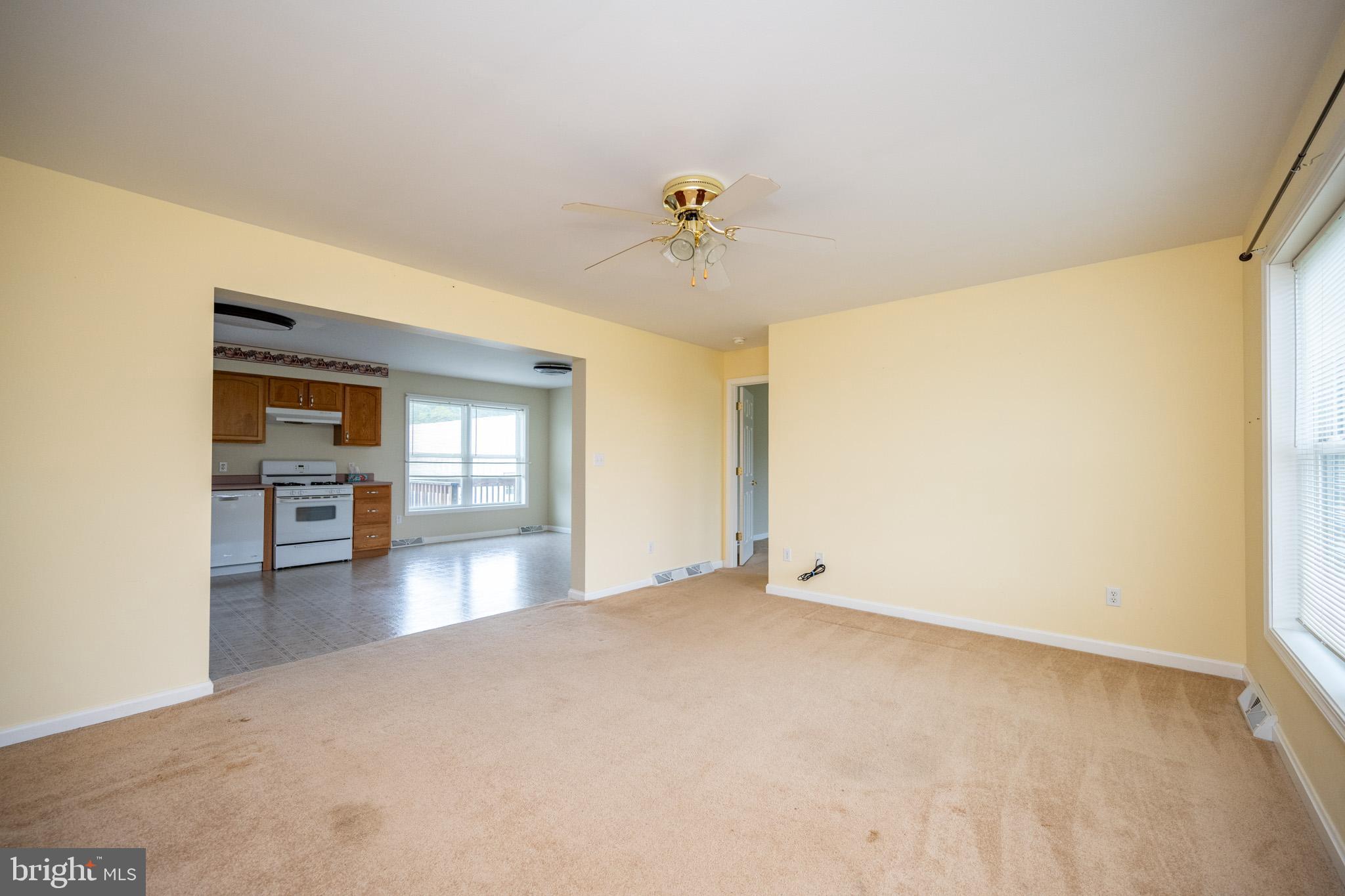 386 Marlin Savage Road Accident, MD 21520 - Photo 39 of 63 a view of a livingroom with wooden floor and a ceiling fan