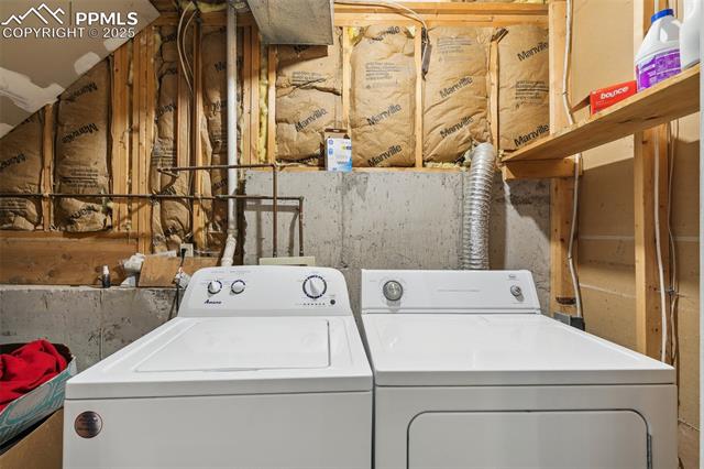 609 Wheat Field Road Fountain, CO 80817 - Photo 27 of 29 Laundry area featuring washing machine and clothes dryer