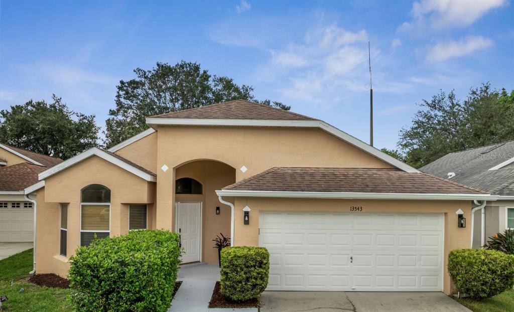 a front view of house with garden