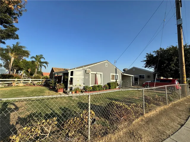 front view of a house with a big yard