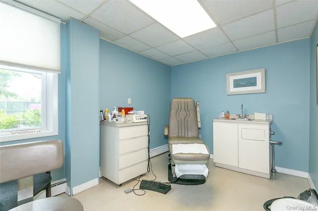 a room with a chair and gym equipment