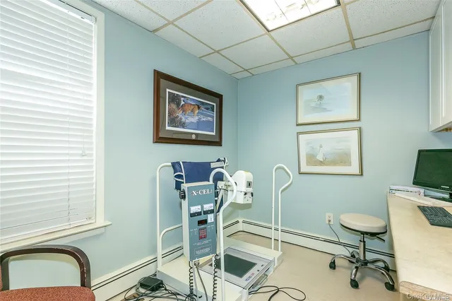 a view of a workspace with furniture