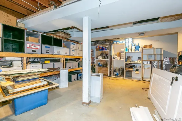 a living room with stainless steel appliances kitchen island granite countertop furniture and a view of living room
