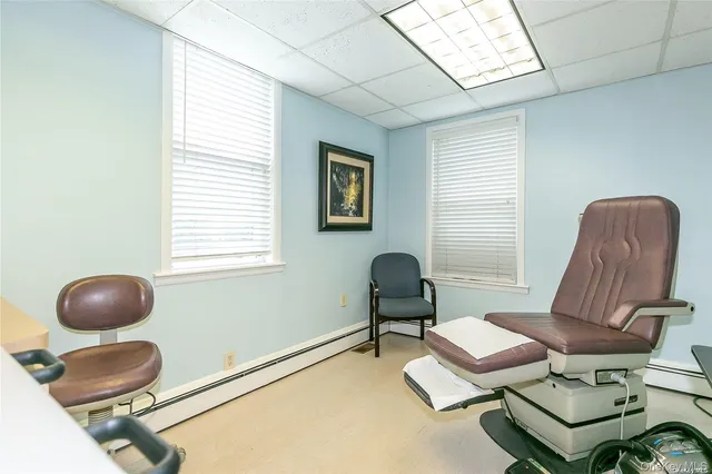 a work room with furniture and a window