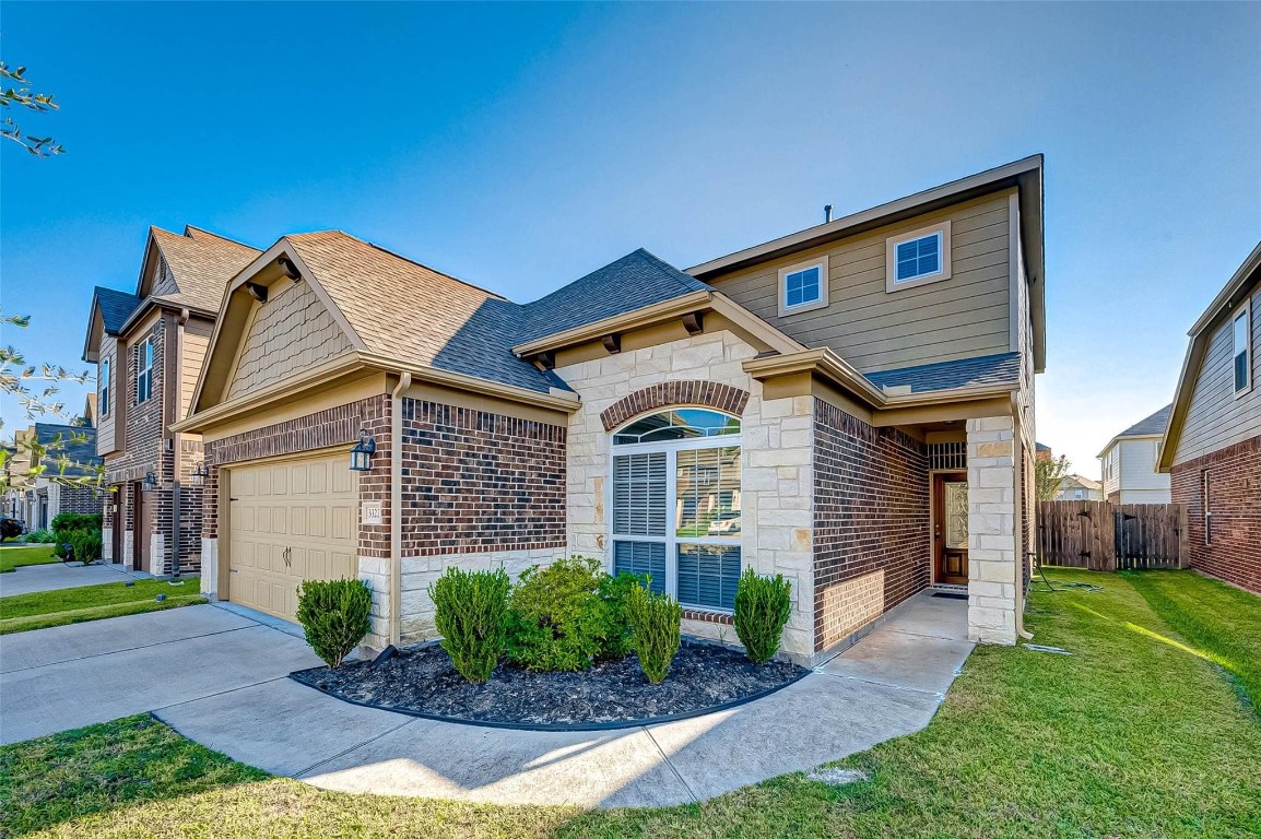 Charming two story home with attractive curb appeal and well maintained landscaping in Barkers Trail.