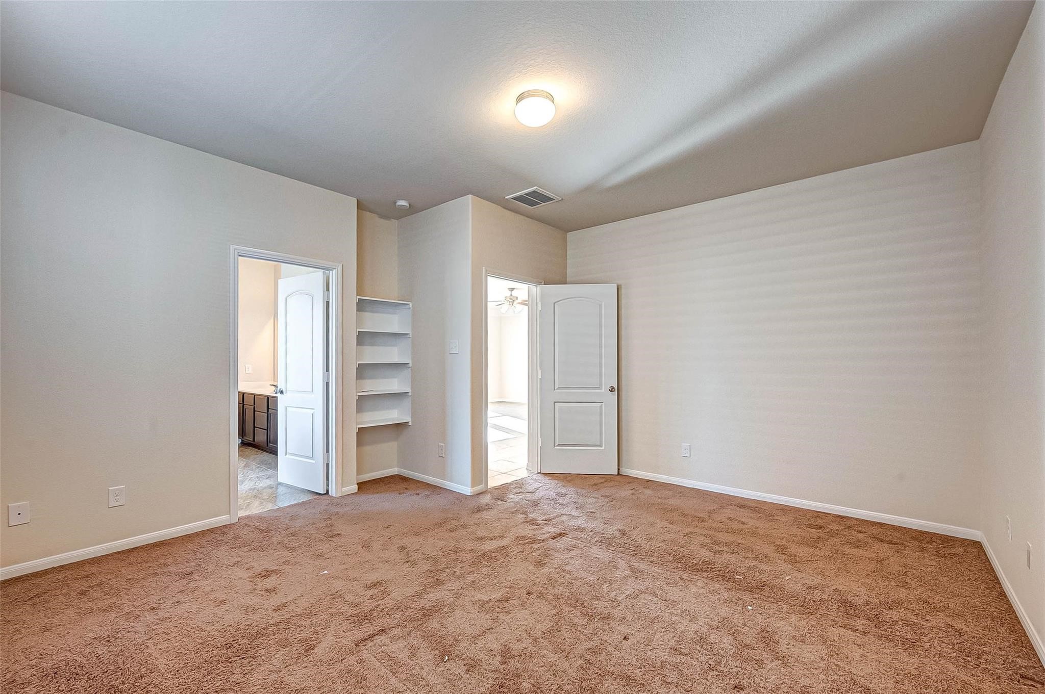 3322 Coopers Ridge Way Houston, TX 77084 - Photo 17 of 41 Primary bedroom offers plenty of space for furnishings.