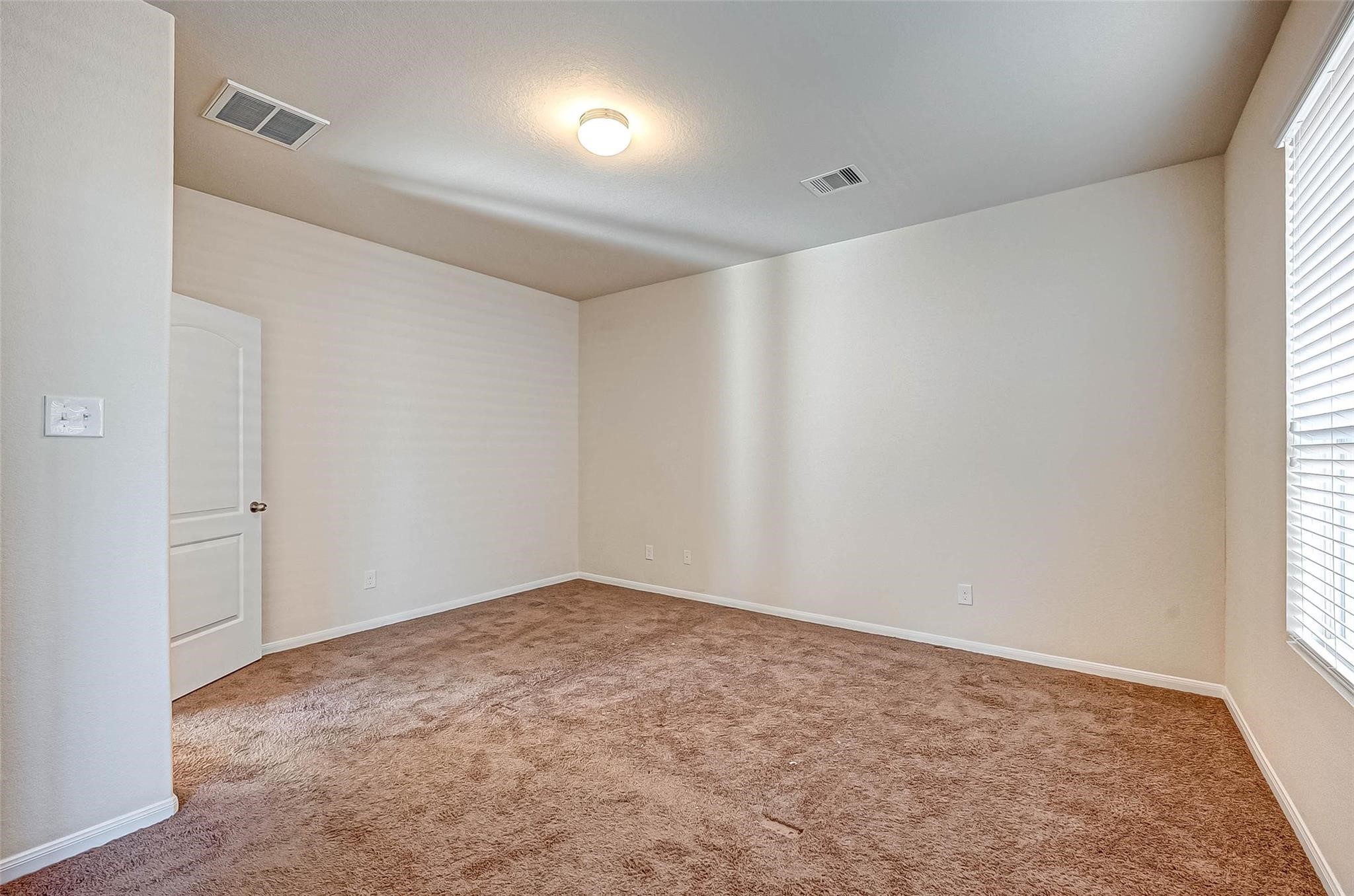 3322 Coopers Ridge Way Houston, TX 77084 - Photo 18 of 41 Well-sized primary suite designed for relaxation.