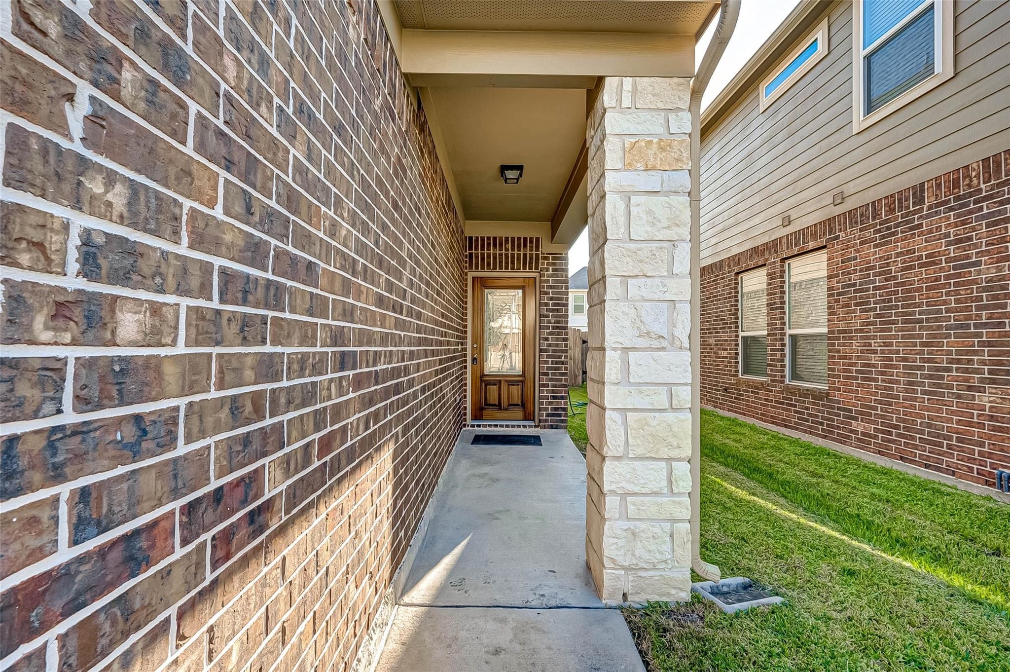 3322 Coopers Ridge Way Houston, TX 77084 - Photo 2 of 41 Covered front doorway with attractive exterior details and a warm, inviting approach to the home.