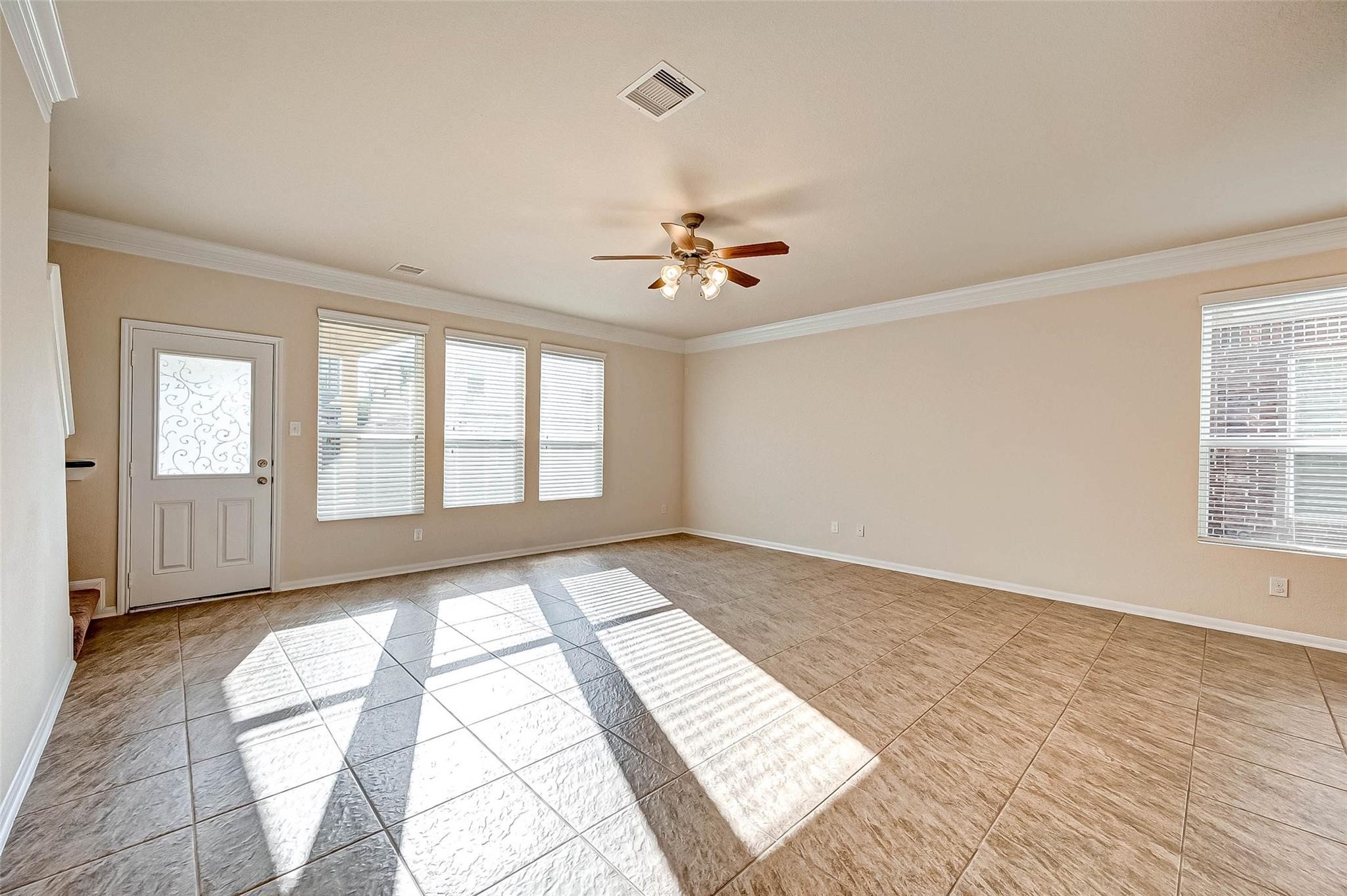 3322 Coopers Ridge Way Houston, TX 77084 - Photo 6 of 41 Living room features easy access to backyard and upstairs.