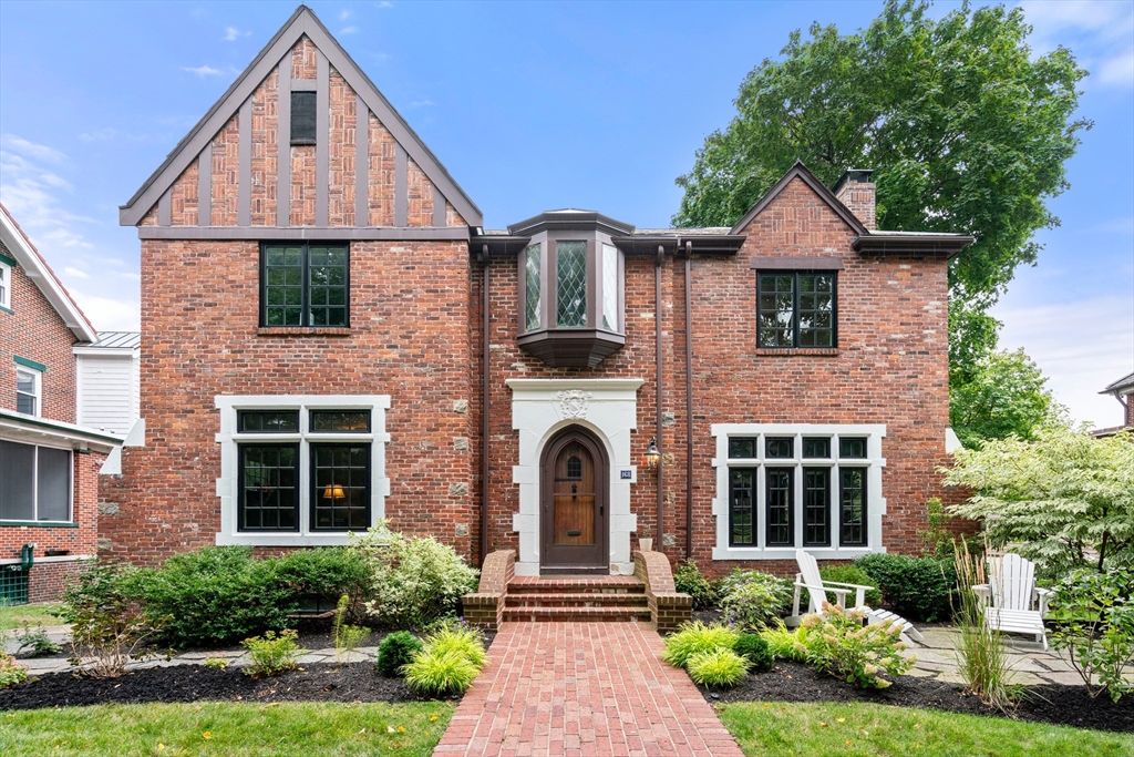 a front view of a house with garden