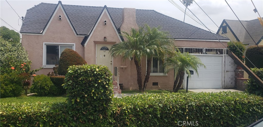 420 South Pearl Avenue Compton, CA 90221 - Photo 1 of 15 a front view of house with a garden