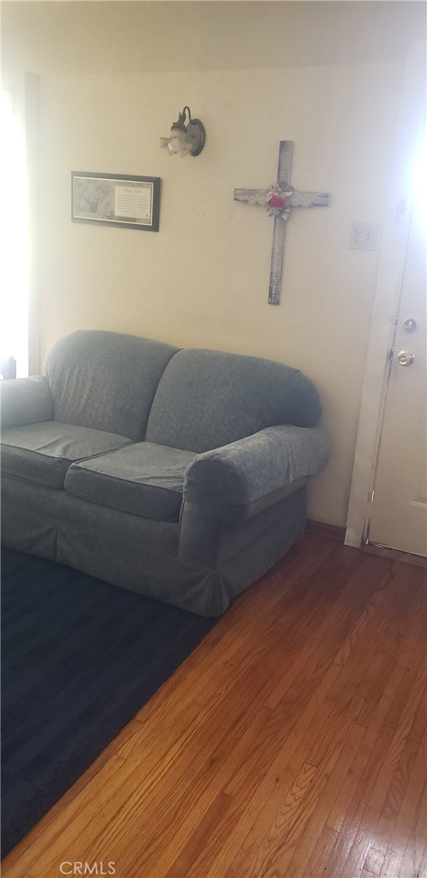 420 South Pearl Avenue Compton, CA 90221 - Photo 2 of 15 a living room with furniture and a wooden floor