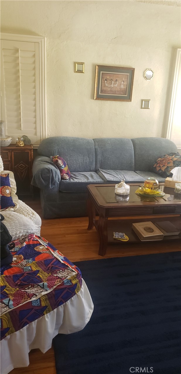 420 South Pearl Avenue Compton, CA 90221 - Photo 3 of 15 a living room with furniture and a rug