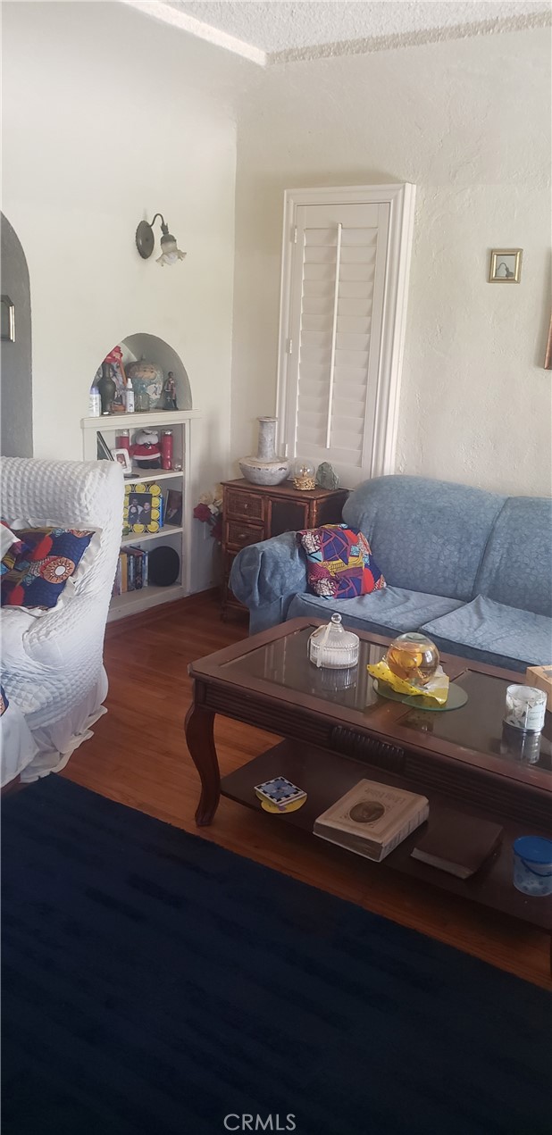 420 South Pearl Avenue Compton, CA 90221 - Photo 4 of 15 a living room with furniture and a table