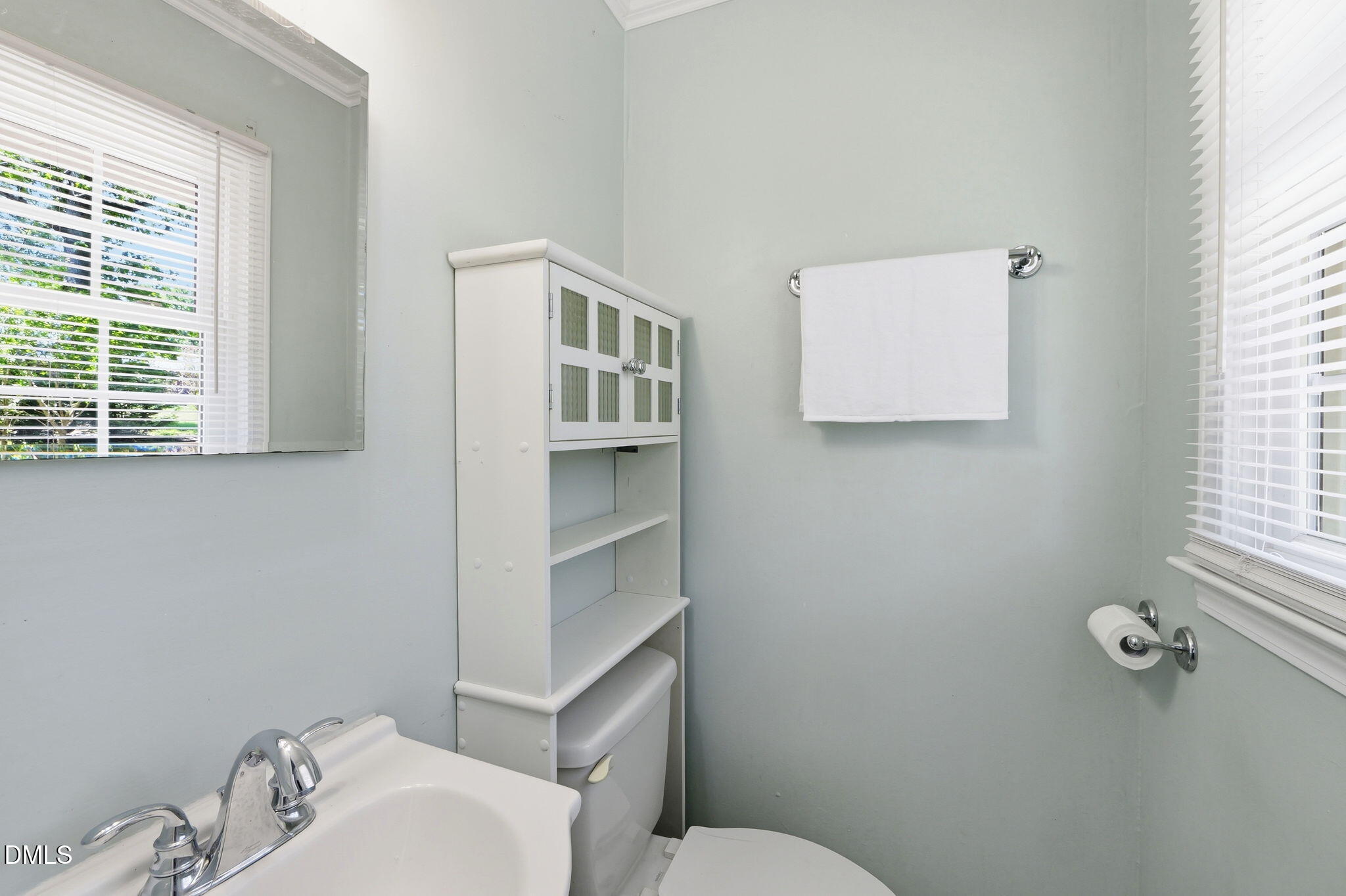 265 Shady Hill Circle Roxboro, NC 27573 - Photo 15 of 18 a white toilet sitting next to a bathroom sink