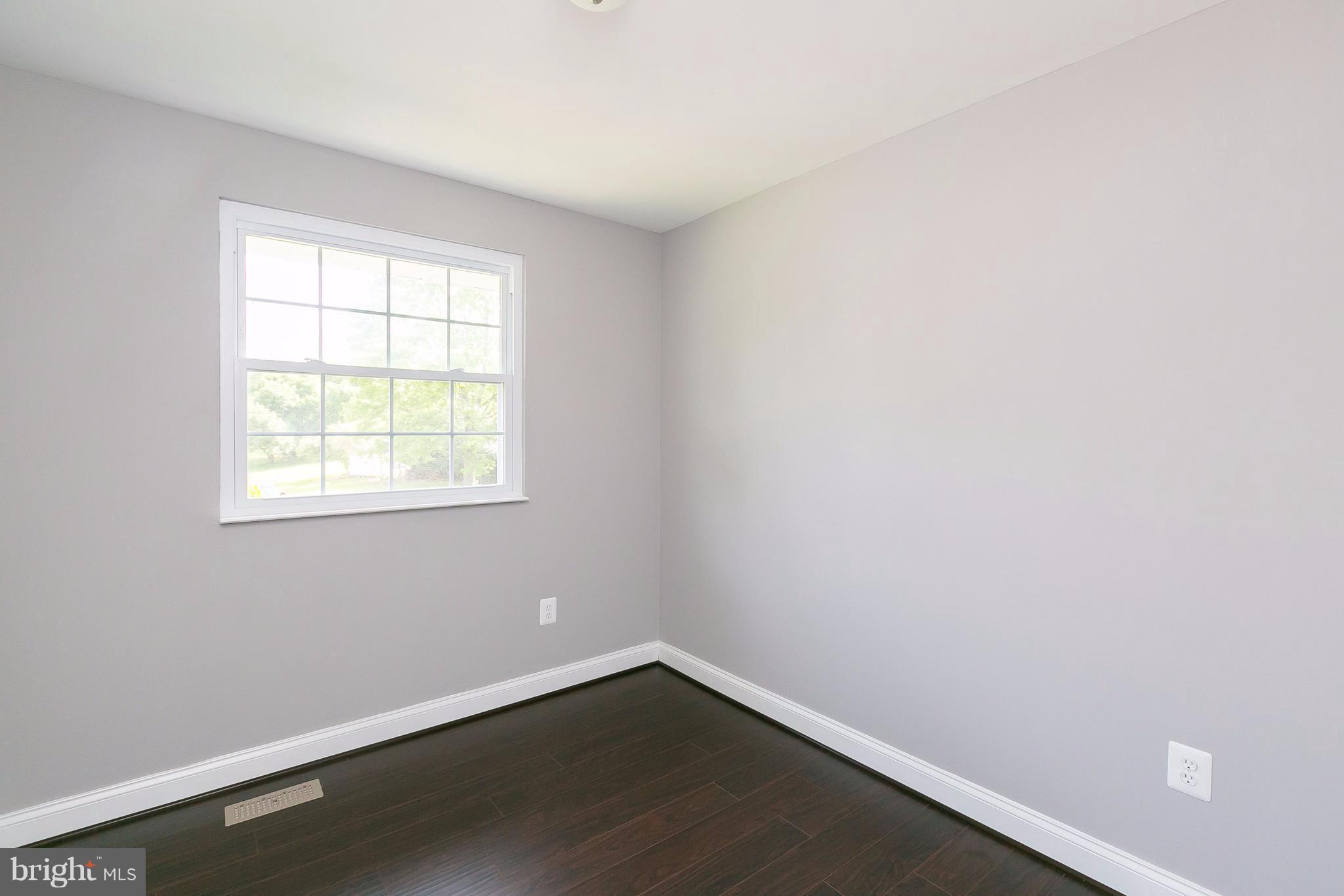 8621 Pilsen Road Randallstown, MD 21133 - Photo 16 of 26 an empty room with a window