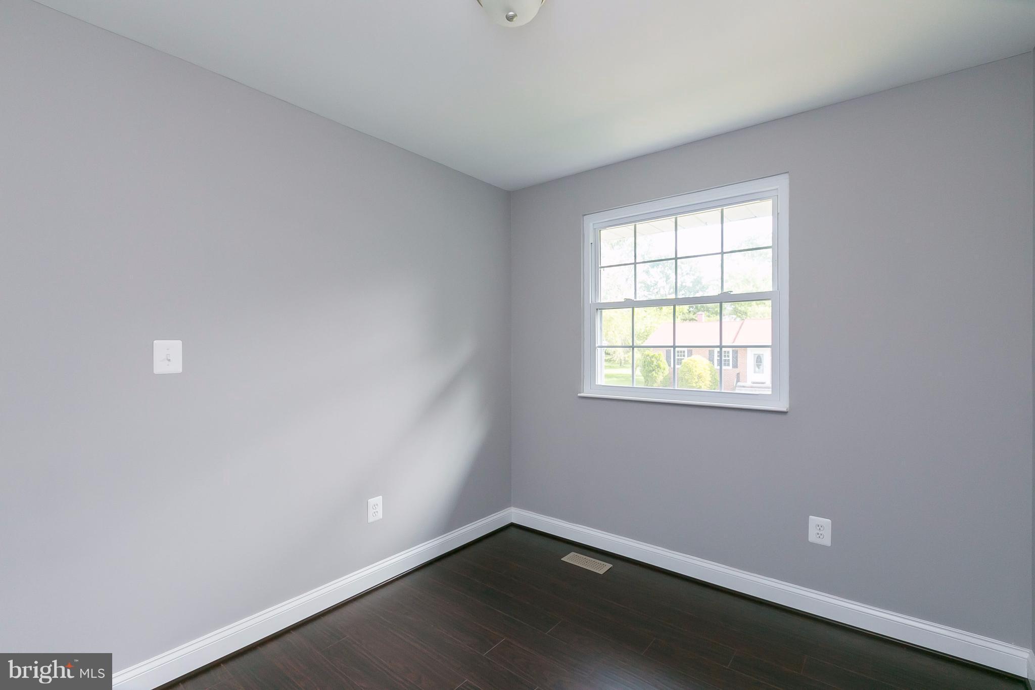 8621 Pilsen Road Randallstown, MD 21133 - Photo 17 of 26 an empty room with a window