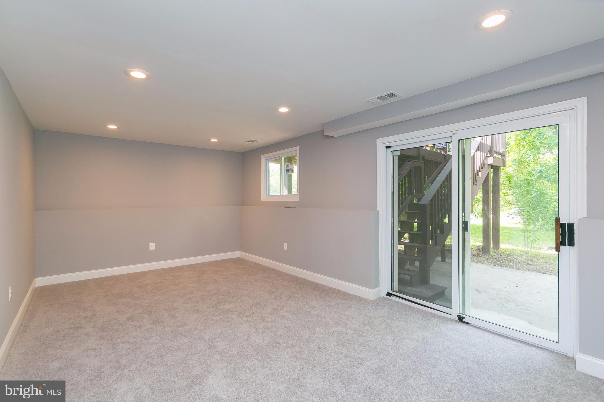 8621 Pilsen Road Randallstown, MD 21133 - Photo 18 of 26 a view of an empty room with glass door and balcony