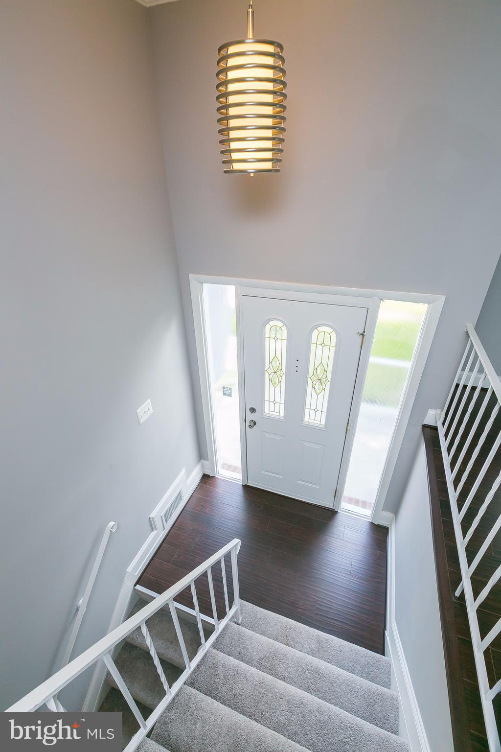8621 Pilsen Road Randallstown, MD 21133 - Photo 3 of 26 a view of entryway and hall with wooden floor