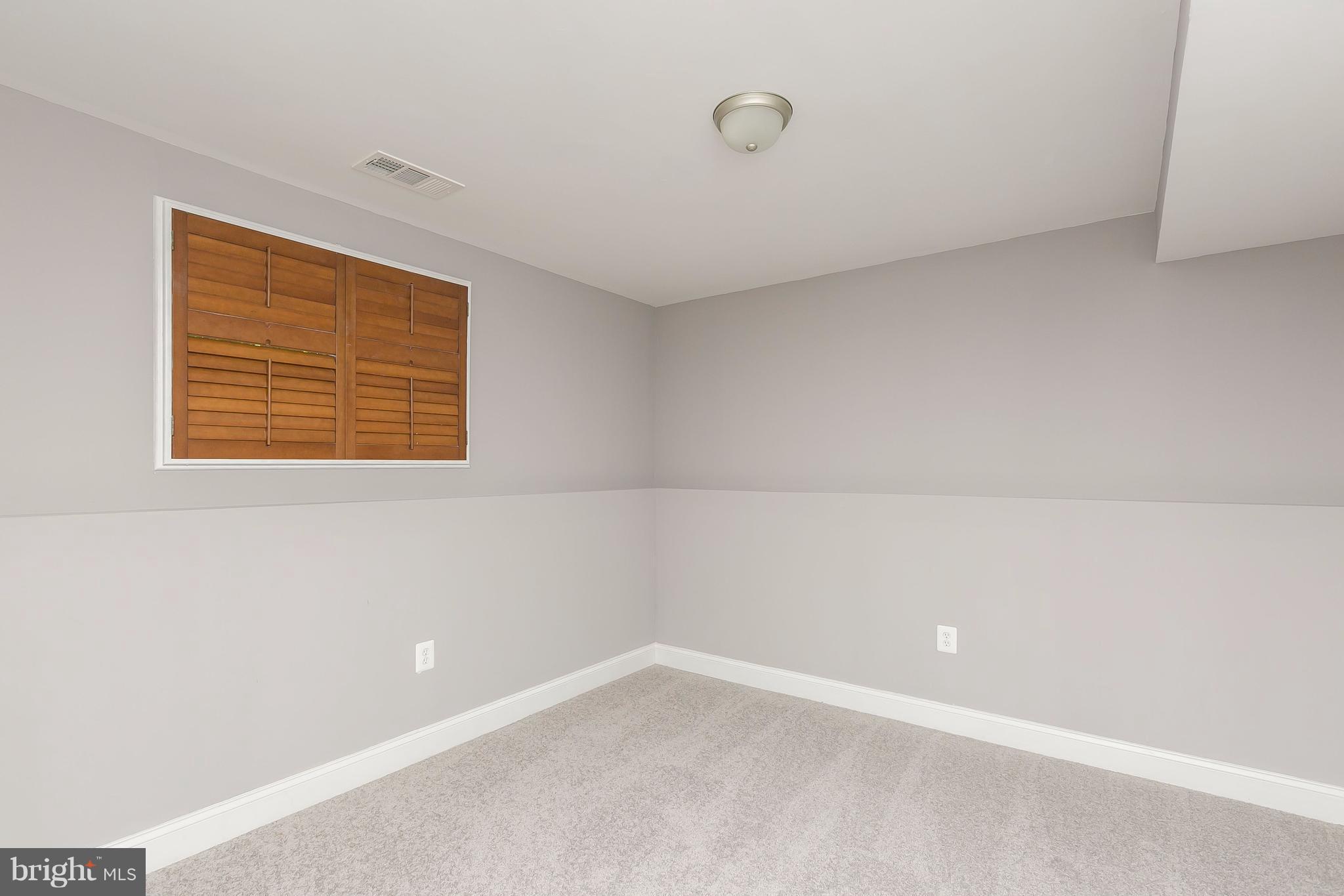 8621 Pilsen Road Randallstown, MD 21133 - Photo 21 of 26 a view of an empty room with a window