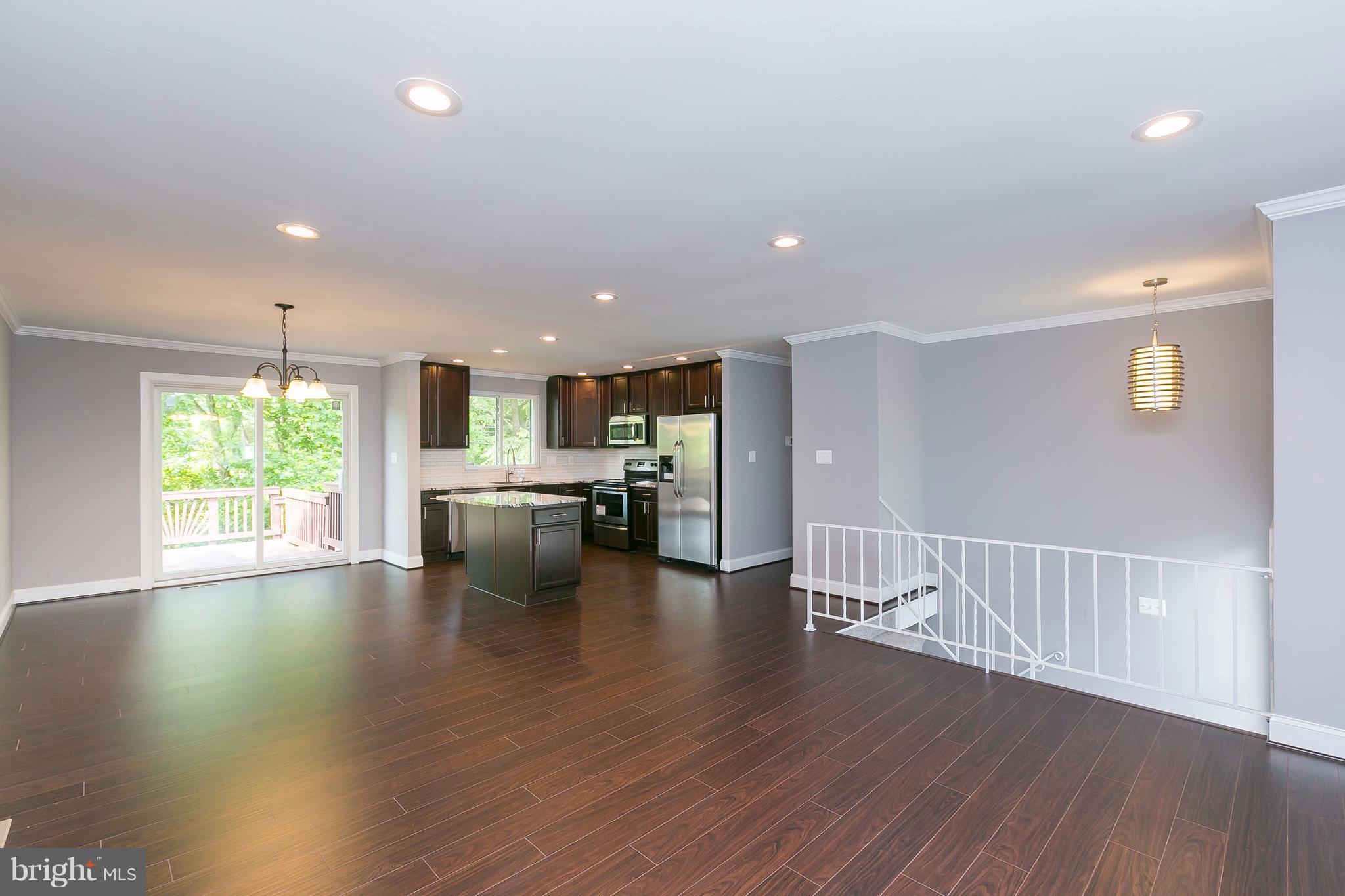 8621 Pilsen Road Randallstown, MD 21133 - Photo 5 of 26 a view of kitchen with stove and wooden floor