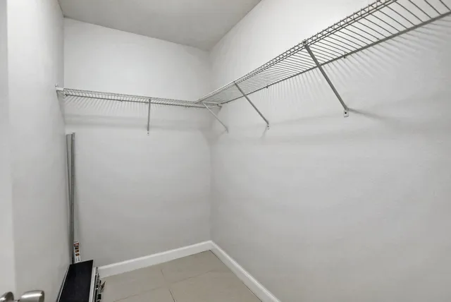 a bathroom with a shower and a sink